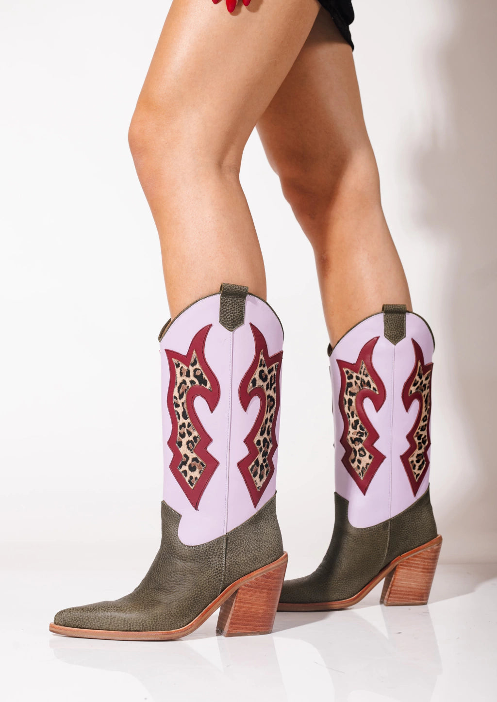 stylish high-heeled western cowboy boots for women colorful cowgirl boots, western high heel boots, modern cowboy boots for women, or statement leather boots.