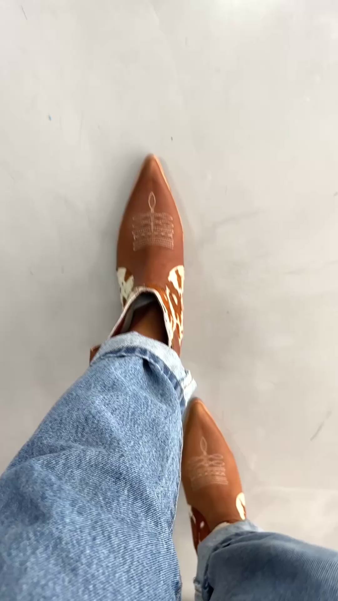 Women's brown and white cowhide leather western ankle boots with pointed toe and low wooden heel
